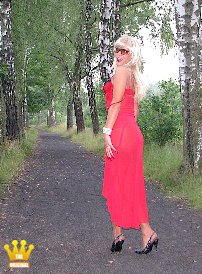 Lady Ewa : On a forest path, the blonde Ewa is in high-heeled Slingpumps on the way. Under her red evening dress, the blonde Polish mare only wears sheer nylons and red sexy lingerie. When she hears rustling in the bushes, she pulls up her long dress and shows her wet fuck-hole. Then she squats to pee on the forest path. In the end, she takes off her red dress and pulls apart her buttocks towards the camera.