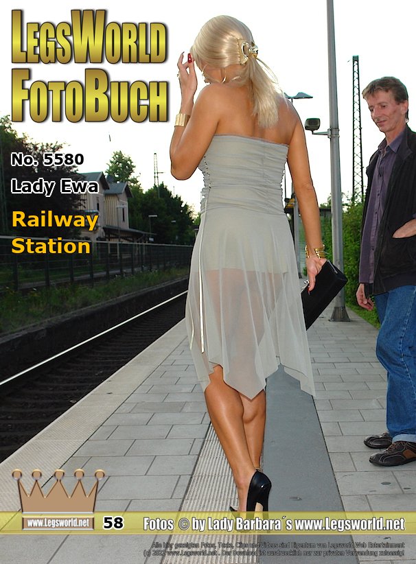 Ebook: 5580 - Lady Ewa
Railway Station
While Lady Ewa (partly smoking a cigarette) in a frivolous summer dress and 16cm heels is waiting for a train, she poses quite casually for the camera. Due to her transparent dress, everyone who is waiting on the platform, clearly can see her blank buttocks. For a traveler standing next to her, seems her dress to be rather strange. He constantly looks over at the blond Polish and offers her fire for her cigarette.
