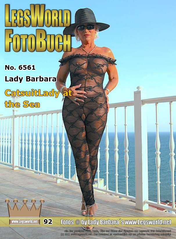 Ebook: 6561 - Lady Barbara
CatsuitLady at the Sea
For all friends of the crotchless catsuits: Here you can see me again in this catsuit, from which my pussy oozes out so nicely. Although everyone can see me from the street and I know that every now and then an old guy is watching me with binoculars, I like to pose with this dress on the terrace. Maybe because of the wanker, because it makes me horny. Would you like to kneel in front of me now and smell or lick my shaved vagina?