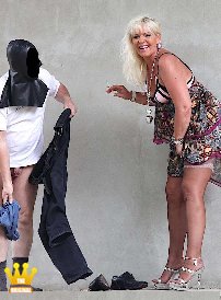 Lady Tamara : At the old train station in a small town in the Rhineland, the masked slave has to undress and gets a handjob from the high-heeled Lady Tamara. The man was really hot on her sheer nylon stockings. In the end, the horny guy jerked a full load of cum on the blonde secretarys sheer nylons.