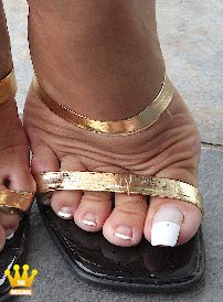 Lady Barbara : Here you see some new photos on my sexy tanned summer feet in hot mules. I hope you like my new french style on the toenails. I am wearing these shoes and my french toenails all the summer at the beach, and a lot of men were gazing at my toes. I like this feeling when men get horny, gazing my toes. And I get horny too.