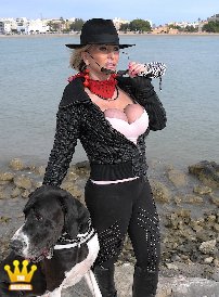 Lady Barbara : Here I show you some private photos from Spain. Today you can see how I usually walk the dog. Leggins and boots underneath and a short jacket on top. Most of the time I dont wear a bra under the top, like here, just my tight rubber bands. When walking the dog or when shopping. But in last case I usually dont have my jacket as open as here.