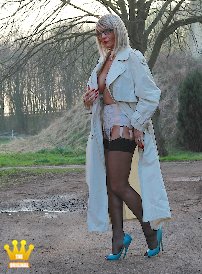 Lady Ewa : Member Thomas from Erkelenz had called Lady Ewa to the old mill in Heinsberg today for a shoot in open-toe 16 cm high pumps and straps under her coat. There the sexy Polish mare had to take off her trench coat and show herself half-naked in front of her admirer in a 1950s suspender belt with sheer black nylon stockings. He was happily jerking off his stiff cock in the background during Lady Ewa